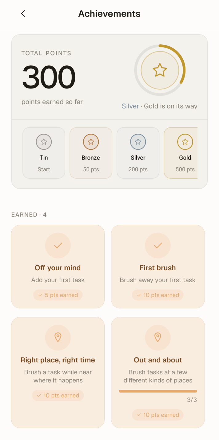 Brush — Achievements screen showing tier progress and earned badges